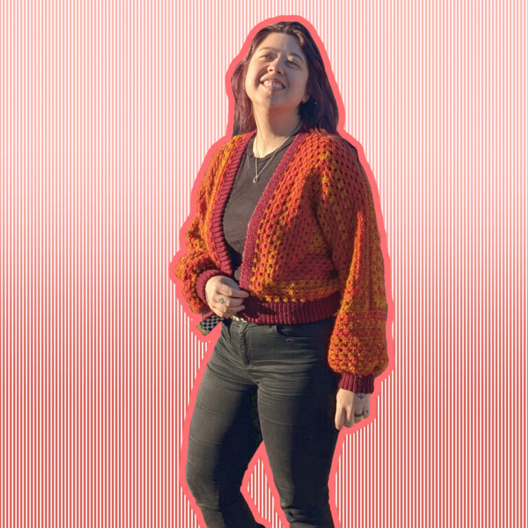 Victoria wearing a crocheted cardigan